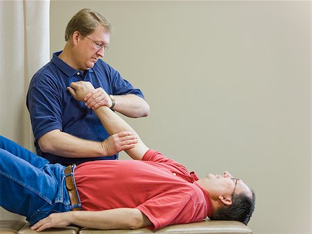 simsearch:640-02949663,k - man doing physical therapy Stock Photo - Premium Royalty-Free, Code: 640-02949671