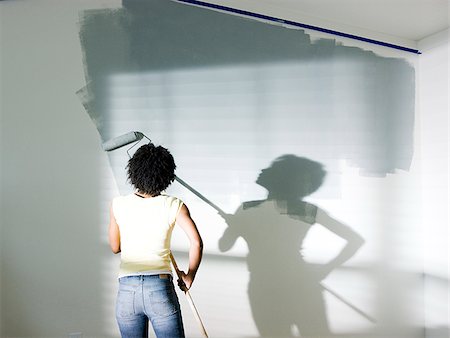 woman painting a room Foto de stock - Sin royalties Premium, Código: 640-02949867