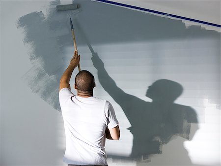 man painting a room Foto de stock - Sin royalties Premium, Código: 640-02949876