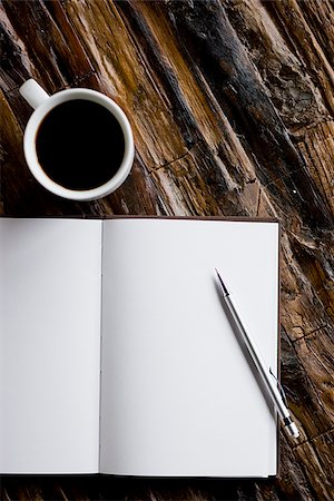 cup of coffee and a journal and pen Stock Photo - Premium Royalty-Free, Code: 640-02949931