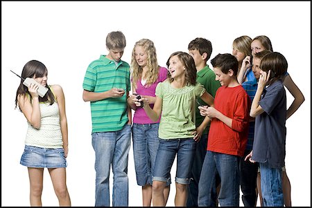 peer pressure - teenagers using cell phones Foto de stock - Sin royalties Premium, Código: 640-02950006