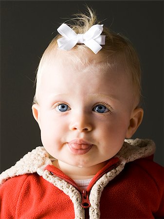 baby girl in a red coat Stock Photo - Premium Royalty-Free, Code: 640-02950279