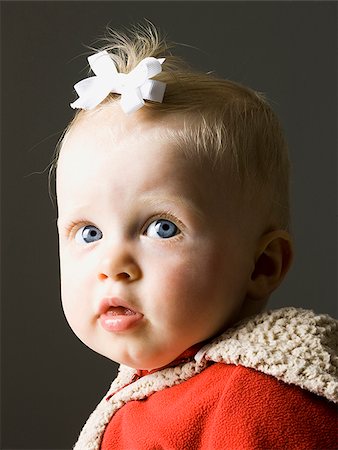 baby girl in a red coat Stock Photo - Premium Royalty-Free, Code: 640-02950280