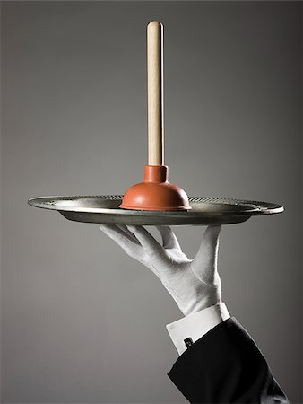 toilet plunger on a platter Fotografie stock - Premium Royalty-Free, Codice: 640-02950334