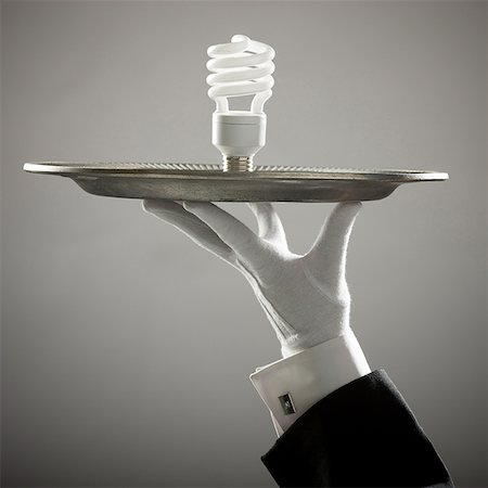 energy saving lightbulb on a platter Fotografie stock - Premium Royalty-Free, Codice: 640-02950336