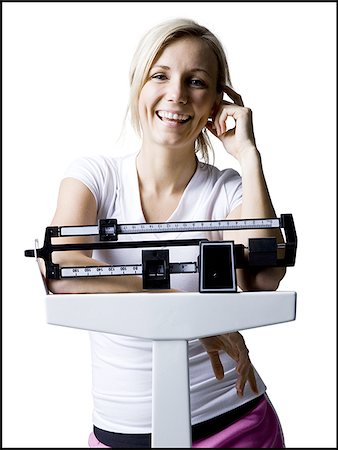 woman on a scale Foto de stock - Sin royalties Premium, Código: 640-02950359