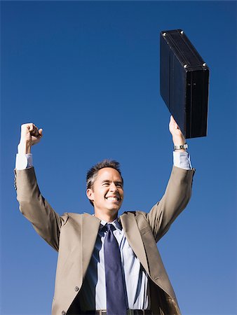 simsearch:640-08089567,k - man holding a briefcase Stock Photo - Premium Royalty-Free, Code: 640-02950387