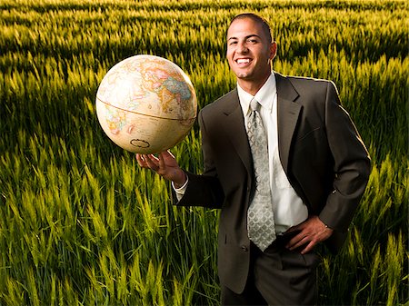 simsearch:640-02950509,k - businessman holding a globe Foto de stock - Sin royalties Premium, Código: 640-02950492