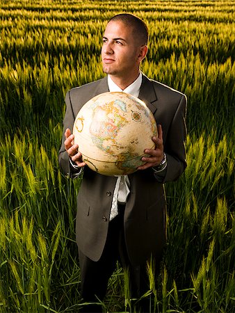 businessman holding a globe Stock Photo - Premium Royalty-Free, Code: 640-02950493
