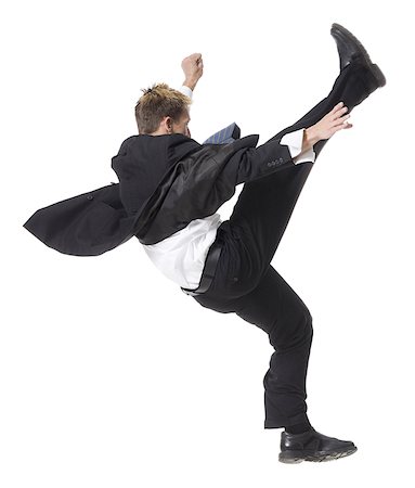 simsearch:640-02950509,k - businessman doing a karate kick Foto de stock - Sin royalties Premium, Código: 640-02950500