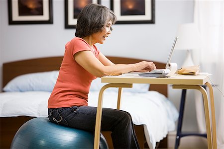 senior woman using a laptop Stock Photo - Premium Royalty-Free, Code: 640-02950563
