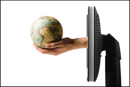 e-commerce - hand coming out of computer holding a globe Foto de stock - Sin royalties Premium, Código: 640-02950597