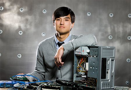man working on a computer Stock Photo - Premium Royalty-Free, Code: 640-02950592