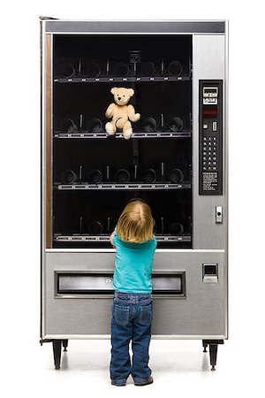 person at vending machine - girl buying a teddy bear from a vending machine Stock Photo - Premium Royalty-Free, Code: 640-02950605