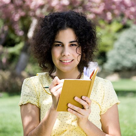 simsearch:640-02953250,k - woman in a yellow dress with her diary Stock Photo - Premium Royalty-Free, Code: 640-02950692