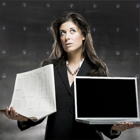 simsearch:640-02950855,k - businesswoman holding a laptop and a newspaper Stock Photo - Premium Royalty-Free, Code: 640-02950838