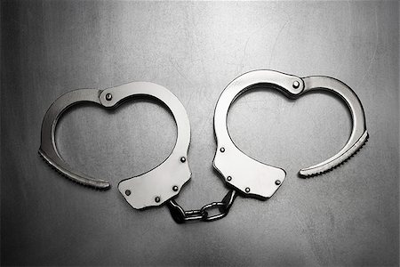handcuffs Fotografie stock - Premium Royalty-Free, Codice: 640-02950943