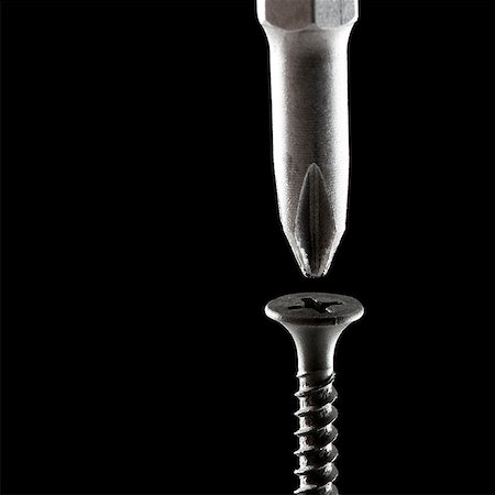 screwdriver about to screw in a wood screw Foto de stock - Sin royalties Premium, Código: 640-02950999