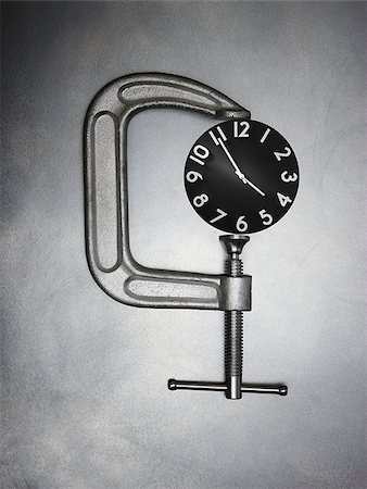 pili - pince sur une horloge Photographie de stock - Premium Libres de Droits, Code: 640-02951003