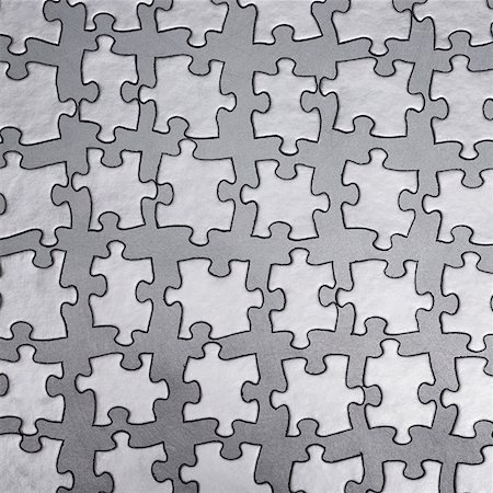 disassemble - silver puzzle Stock Photo - Premium Royalty-Free, Code: 640-02951015