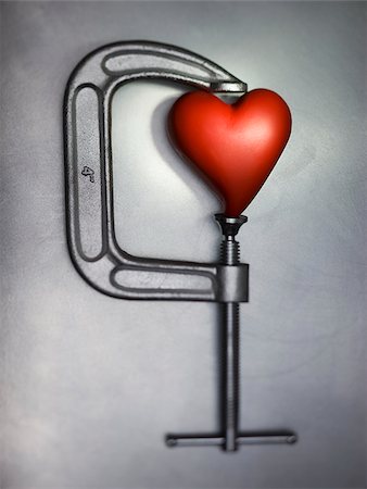 heart in a clamp Stock Photo - Premium Royalty-Free, Code: 640-02951012