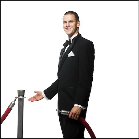 smokings - man in a tuxedo next to a velvet rope Foto de stock - Sin royalties Premium, Código: 640-02951025