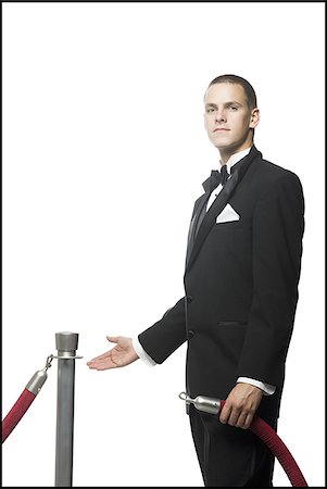 stanchion cordon - man in a tuxedo next to a velvet rope Stock Photo - Premium Royalty-Free, Code: 640-02951026