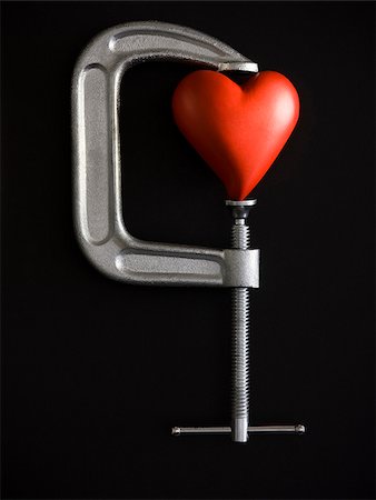 heart in a clamp Stock Photo - Premium Royalty-Free, Code: 640-02951068