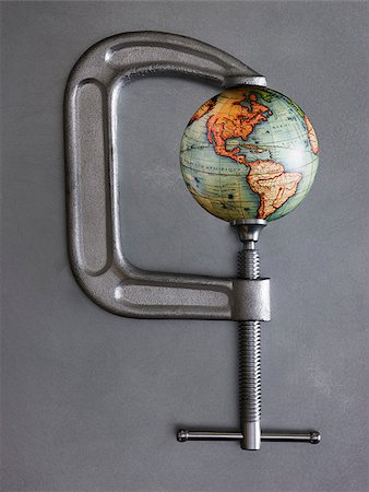globe in a clamp Stock Photo - Premium Royalty-Free, Code: 640-02951106