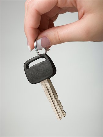 main tenant une clé de voiture Photographie de stock - Premium Libres de Droits, Code: 640-02951101