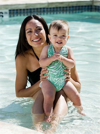 mother swimming with her baby girl Stock Photo - Premium Royalty-Free, Code: 640-02951172