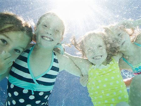 plugging nose - children in a swimming pool Stock Photo - Premium Royalty-Free, Code: 640-02951321
