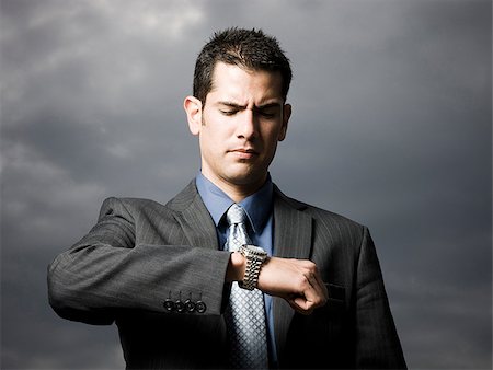 simsearch:640-02950901,k - businessman looking at watch Stock Photo - Premium Royalty-Free, Code: 640-02951450