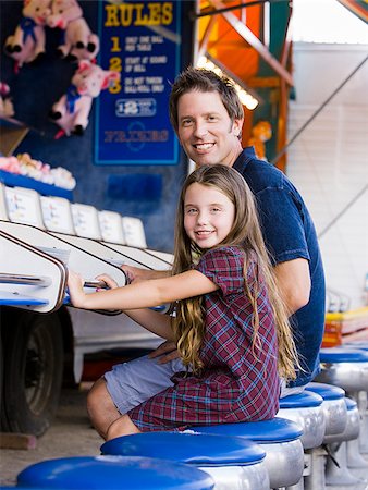 family in theme park - father and daughter at a carnival Stock Photo - Premium Royalty-Free, Code: 640-02951496