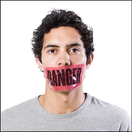 simsearch:640-02951546,k - man with danger tape over mouth Stock Photo - Premium Royalty-Free, Code: 640-02951540