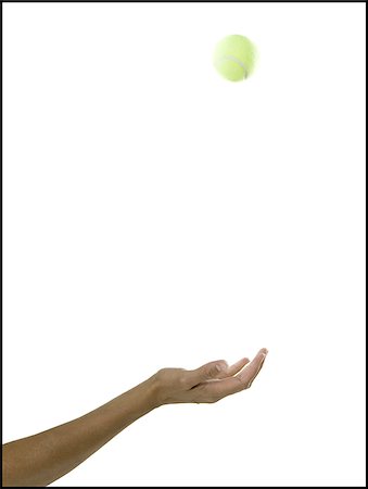 palla da tennis - hand tossing a tennis ball Fotografie stock - Premium Royalty-Free, Codice: 640-02951695