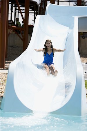 woman on a water slide Stock Photo - Premium Royalty-Free, Code: 640-02951735