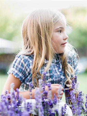 salvia pratensis - girl behind patch of flowers Stock Photo - Premium Royalty-Free, Code: 640-02951777