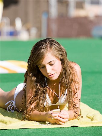 teenage girl in a white swimsuit Stock Photo - Premium Royalty-Free, Code: 640-02951784