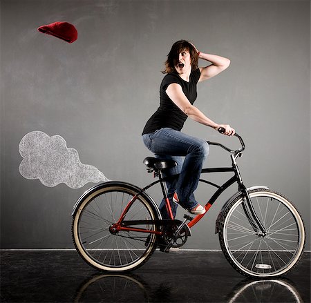 simsearch:640-02951833,k - woman on a bicycle Foto de stock - Royalty Free Premium, Número: 640-02951815