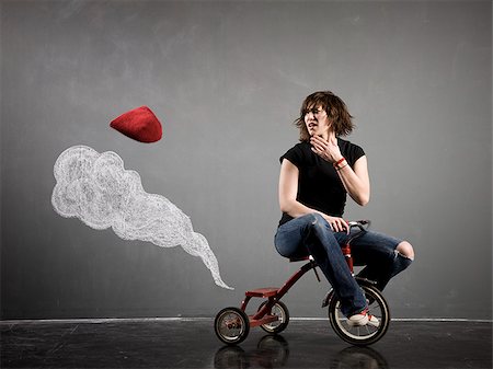 woman on a tricycle Stock Photo - Premium Royalty-Free, Code: 640-02951826