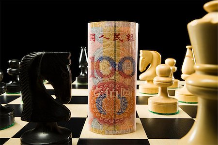 renminbi - rolled currency on a chess board Stock Photo - Premium Royalty-Free, Code: 640-02951830