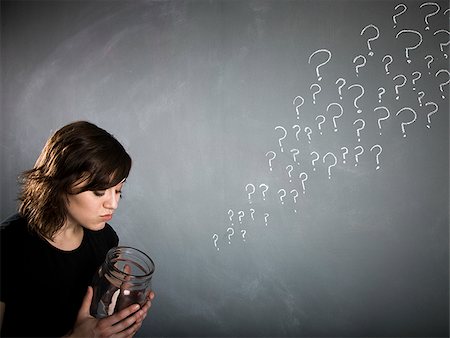 woman with a jar full of question marks Stock Photo - Premium Royalty-Free, Code: 640-02951848
