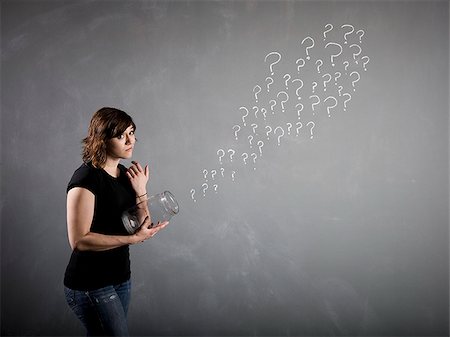 question mark symbol - woman with a jar full of question marks Foto de stock - Sin royalties Premium, Código: 640-02951843