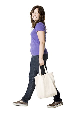 people walking white background - woman carrying a bag Stock Photo - Premium Royalty-Free, Code: 640-02952035