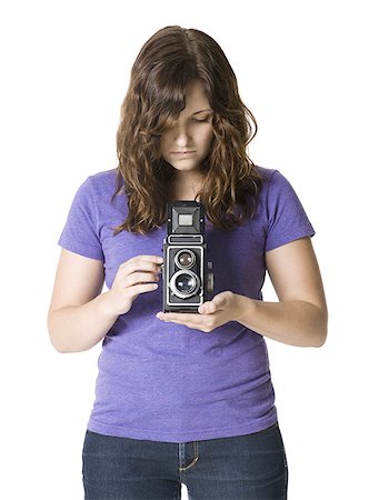 simsearch:640-02951833,k - woman holding a camera Foto de stock - Royalty Free Premium, Número: 640-02952040