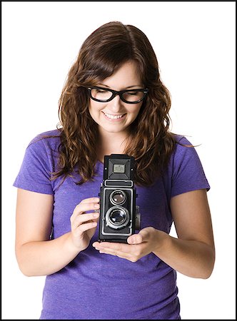 simsearch:640-03257317,k - woman holding a camera Fotografie stock - Premium Royalty-Free, Codice: 640-02952041