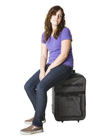 photographs of sad waiting women - woman with a suitcase Stock Photo - Premium Royalty-Free, Code: 640-02952043