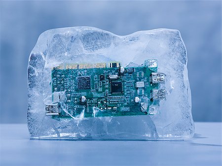 computer chip frozen in a block of solid ice Stock Photo - Premium Royalty-Free, Code: 640-02952119