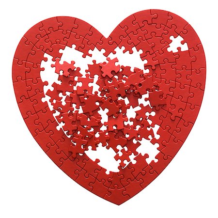 red heart shaped jigsaw puzzle on a white background Fotografie stock - Premium Royalty-Free, Codice: 640-02952136
